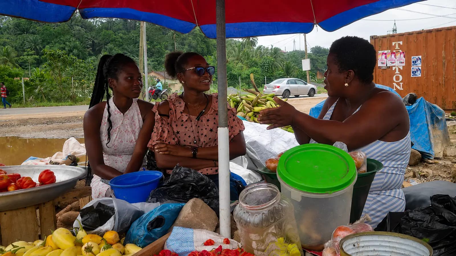 People checking produce together at a market
